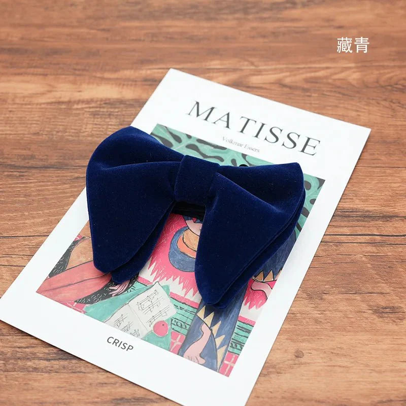 Black velvet oversized bow tie and pocket square set for tuxedos, featuring red, navy, white, and green accents with a stylish bowknot.