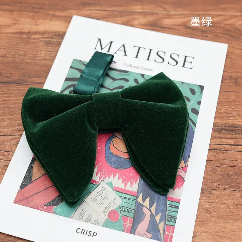 Black velvet oversized bow tie and pocket square set with red, navy, white, and green accents, perfect for tuxedo accessories.
