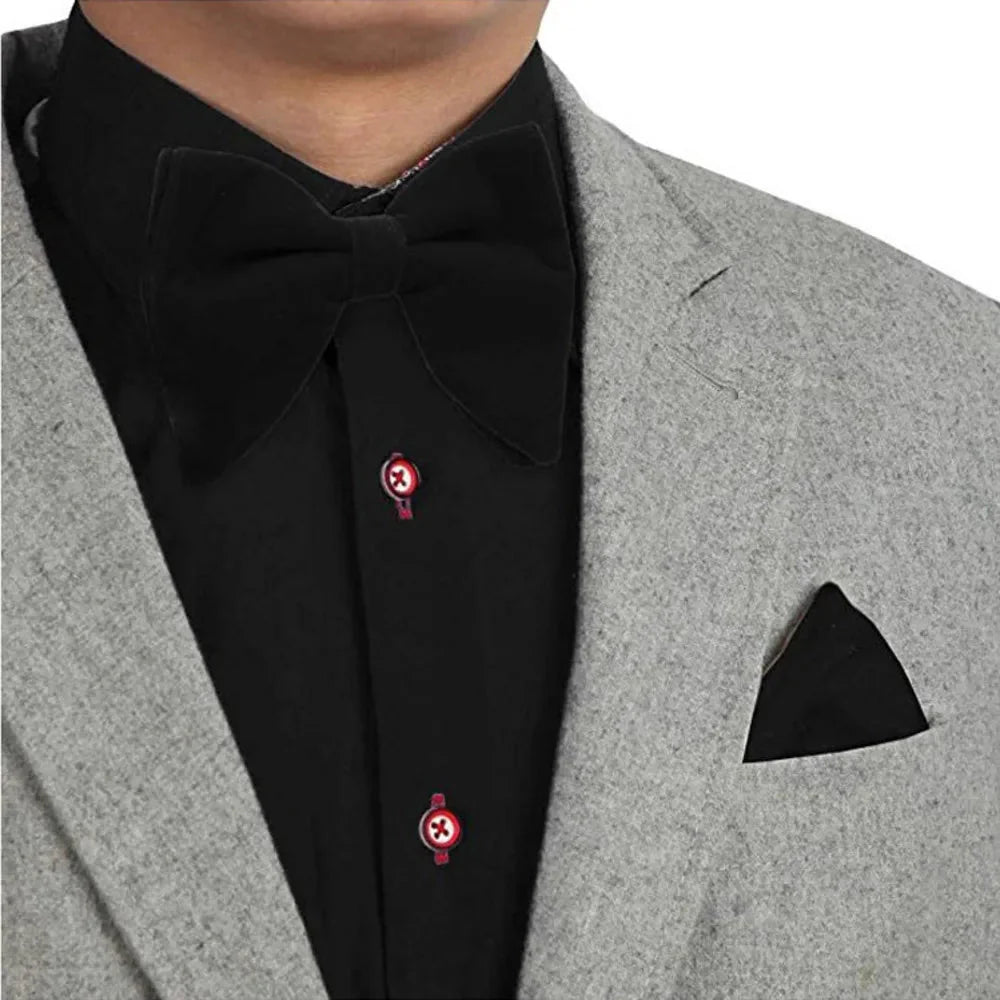 Black velvet oversized bow tie and pocket square set for tuxedos, featuring red, navy, white, and green accents, stylish men's accessories