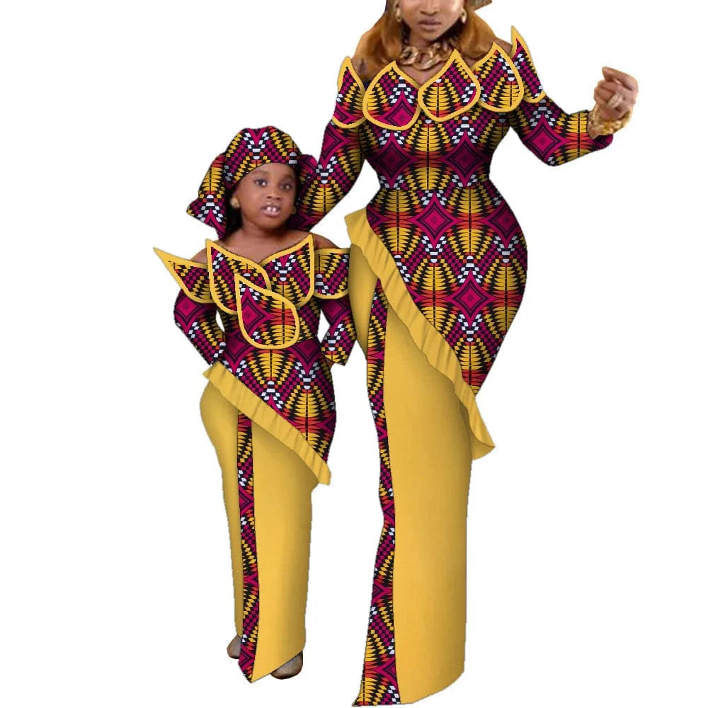 Mom and daughter wearing matching Ankara African wax print maxi dresses in cotton, featuring vibrant traditional dashiki patterns.