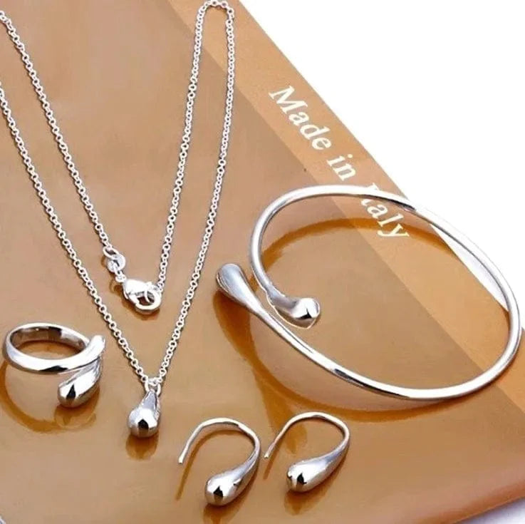 Showlu S925 silver water drop jewelry set with zircon necklace, ring, earrings, and bracelet for women, elegant and stylish.