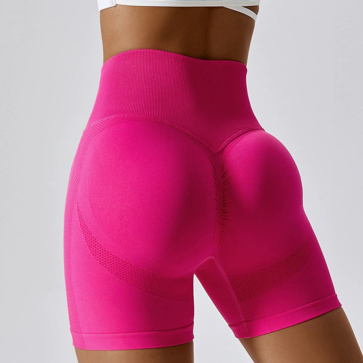 Showlu Seamless High Waist Peach Yoga Shorts with hip lift and slimming fit, ideal for fitness, running, and sports activities.
