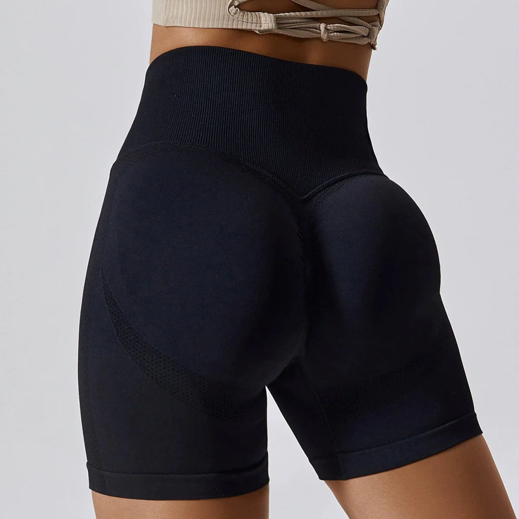 Showlu Seamless High Waist Peach Yoga Shorts with hip-raising design, slim fit, suitable for fitness, running, and workout activities.