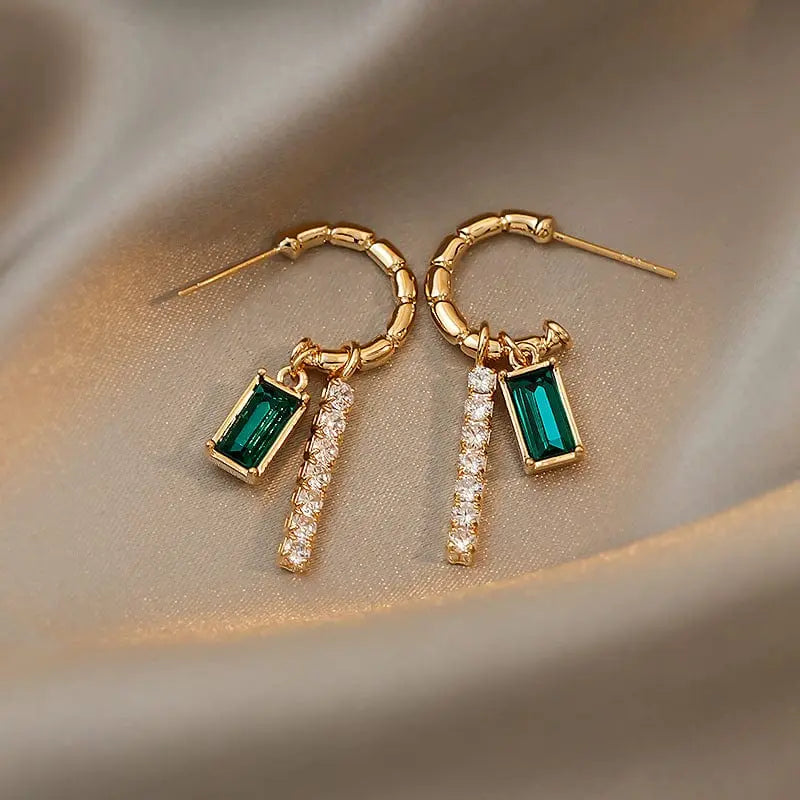 Green crystal rhinestone earrings with trendy alloy design, showcasing sparkling details and fashionable jewelry style.