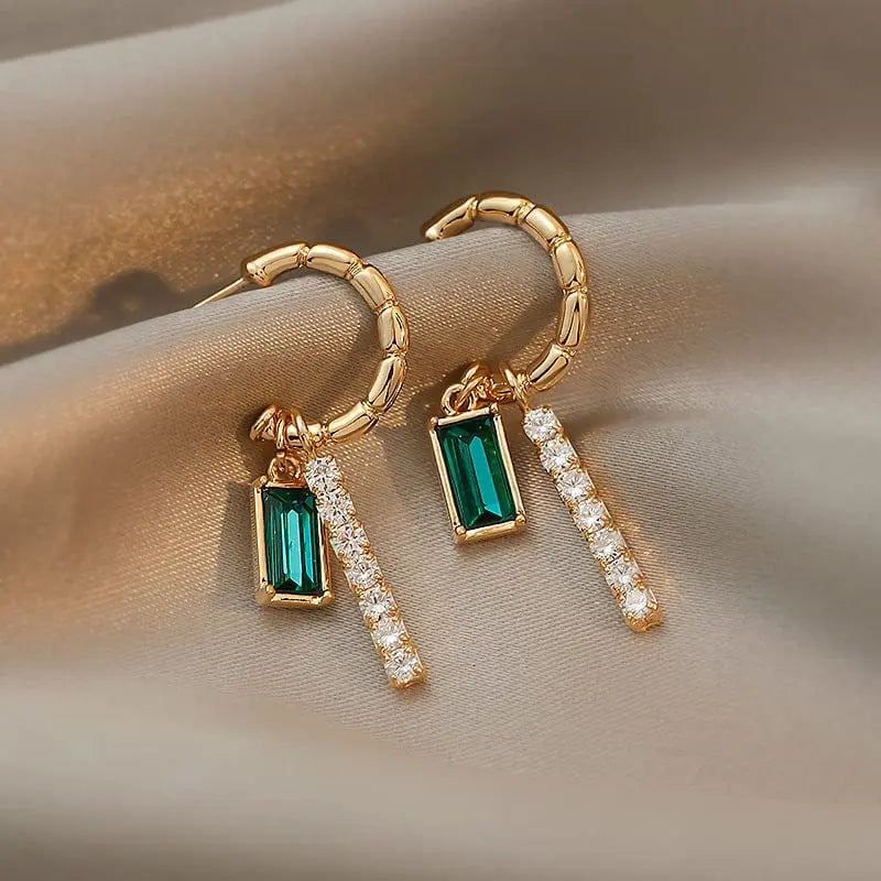 Green crystal rhinestone earrings with trendy alloy design, featuring sparkling embellishments and stylish fashion jewelry.