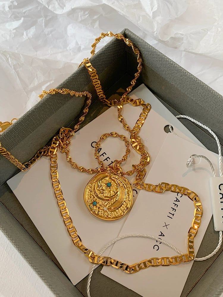 Turquoise star and moon pendant necklace with vintage gold coin brass design, featuring a lightweight, stylish twin clavicle chain.