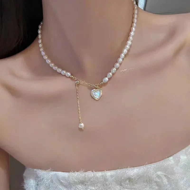 Elegant double-layer pearl love pendant necklace by Showlu Fashion, featuring copper jewelry design for women on special occasions.