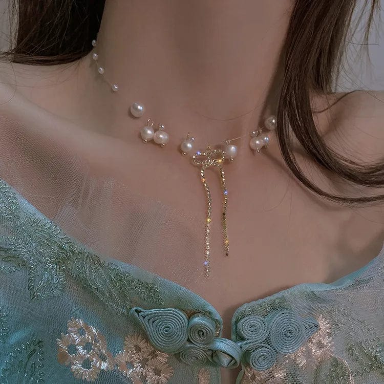 Elegant double-layer pearl love pendant necklace for women, featuring copper jewelry with a sophisticated design.
