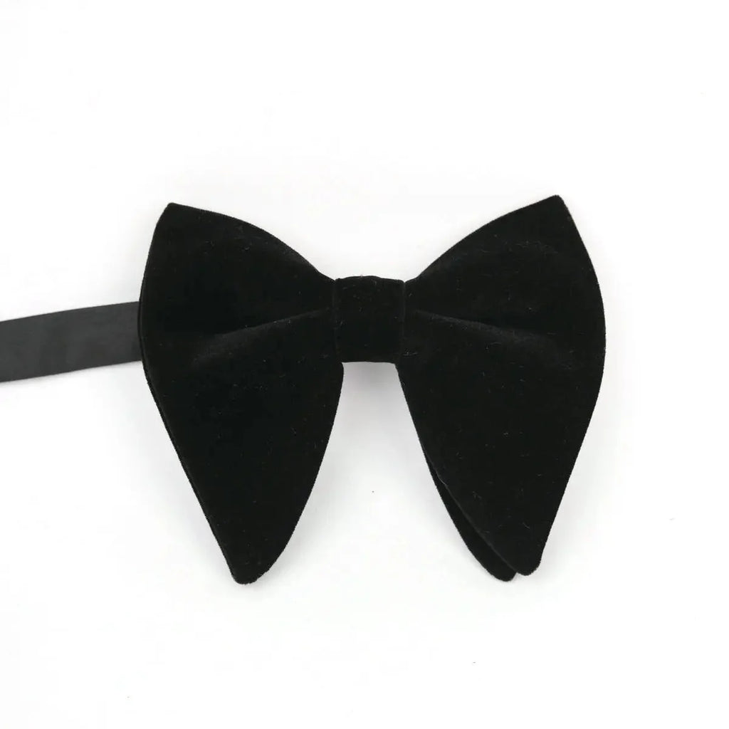 Large velvet bow tie for men, formal flannelette style, shown with a tuxedo and wedding attire, perfect for weddings and formal events.