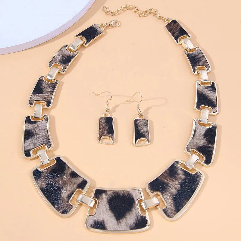 Vintage leopard jewelry set by Showlu, includes geometric resin choker and matching earrings in golden color.