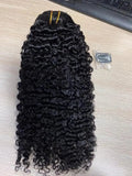 Afro kinky curly clip-in hair extensions by Showlu Fashion Store, 100% raw Brazilian virgin hair in natural dark shades.