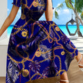 SHOWLU Women's Tropical Chain Print A-Line Dress in blue and gold fabric, featuring a vibrant tropical pattern and elegant silhouette.