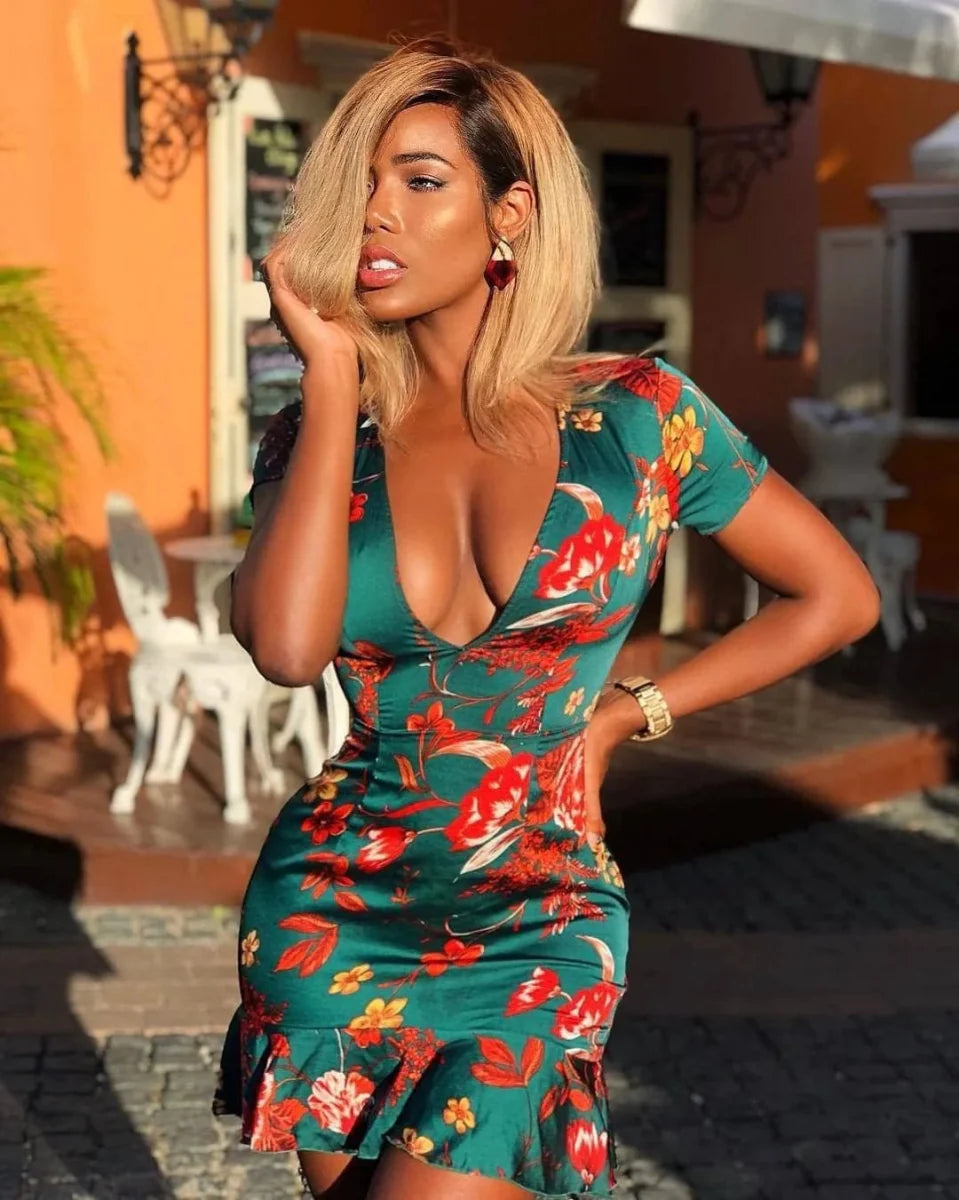 Showlu Floral Lace-Up Backless Mini Dress with V-neck and ruffles, featuring a stylish floral design and backless detail.
