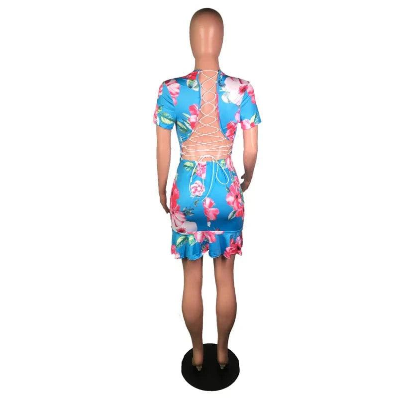 Showlu Floral Lace-Up Backless Mini Dress with sexy V-neck and ruffled details, perfect for stylish summer occasions.