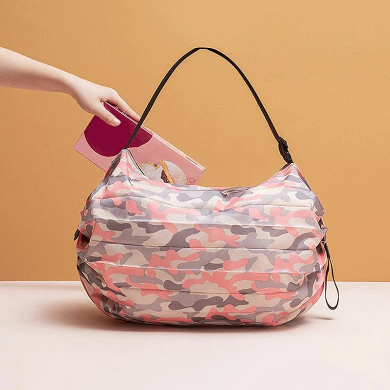 Large camouflage nylon foldable shopping bag with handle, spacious travel handbag for shopping and storage.