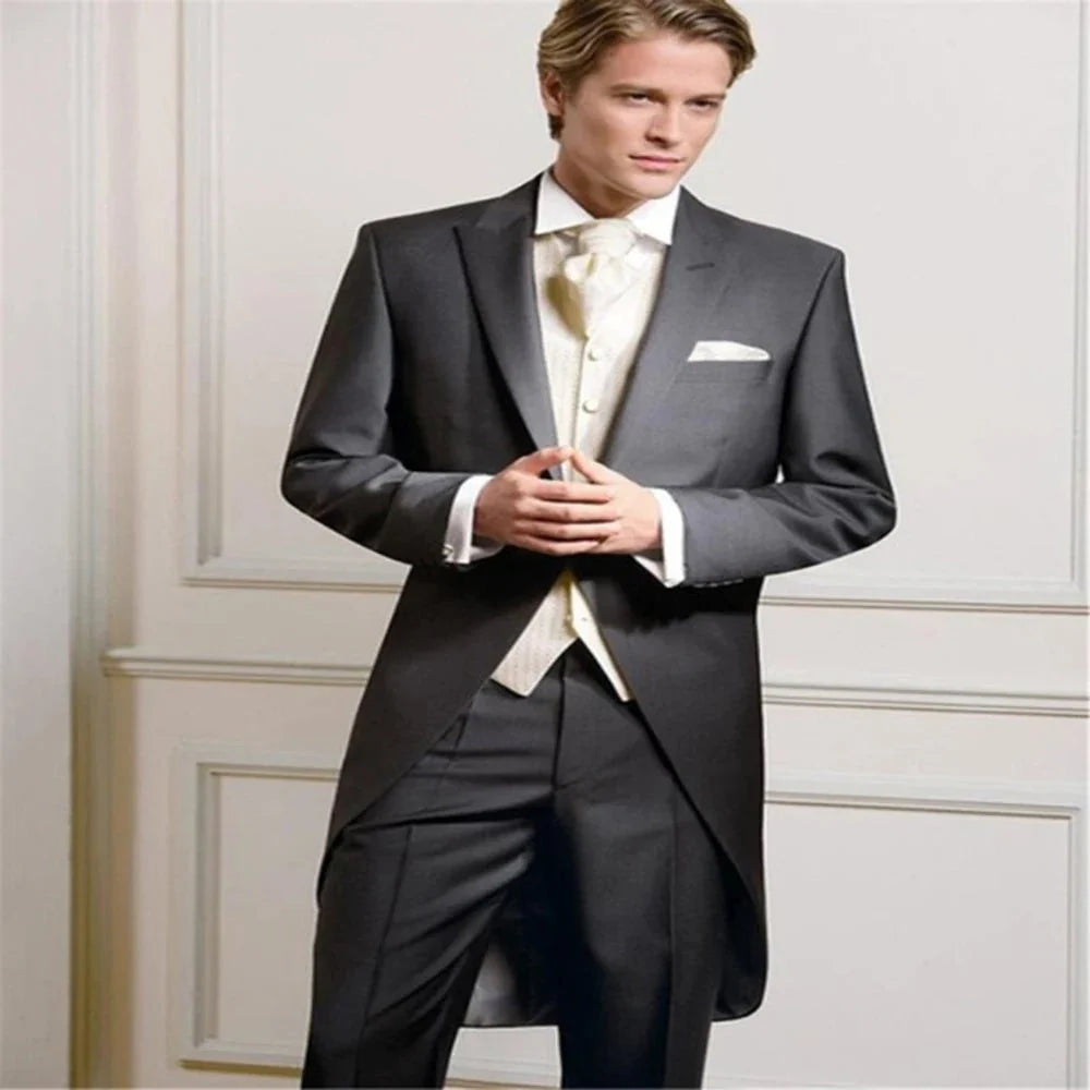 Black Kromoc men's 3-piece swallow-tailed tuxedo suit with peak lapel, waistcoat, and trousers for weddings and formal events.