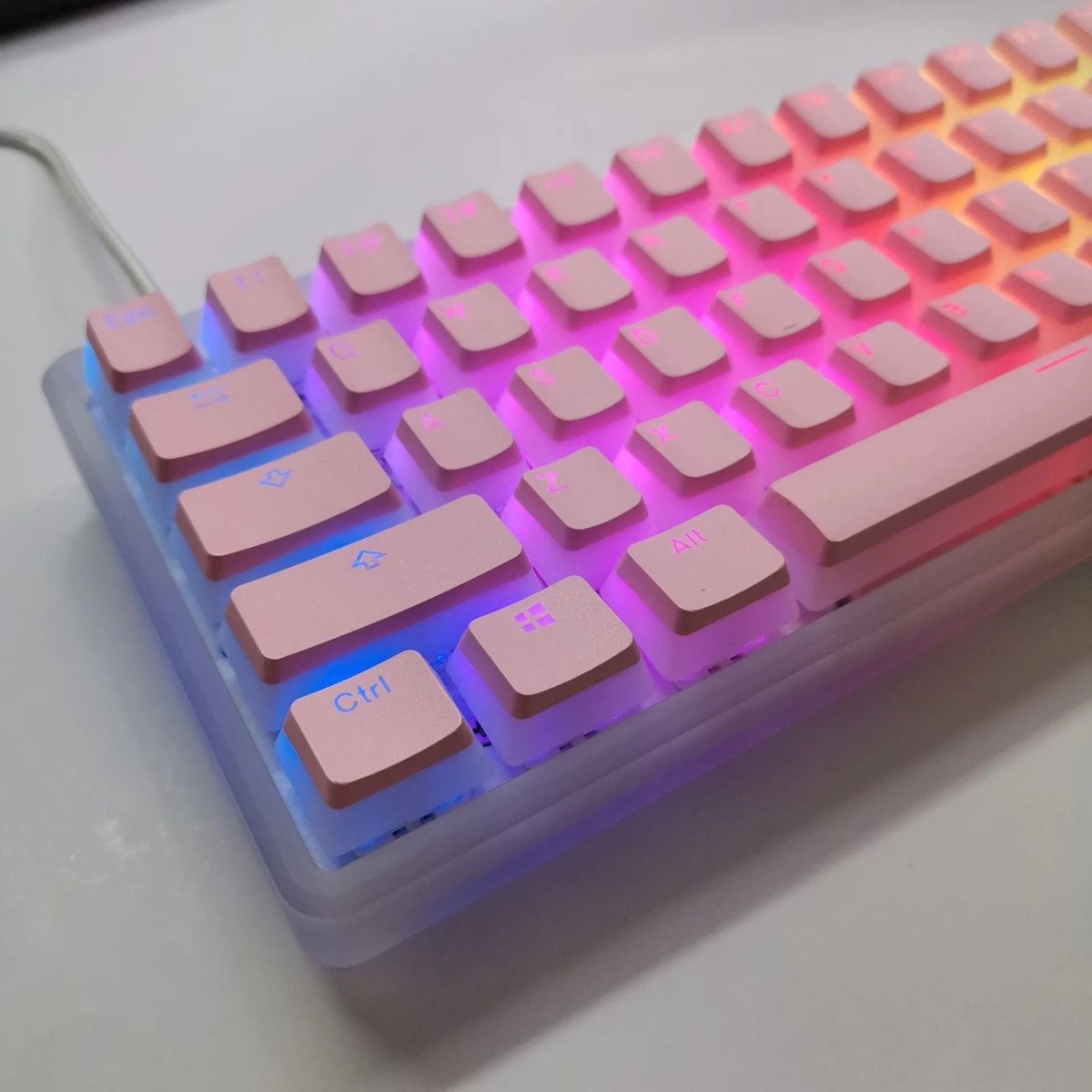 Pink double shot PBT pudding keycaps set for mechanical keyboards, featuring translucent OEM style keycaps with black legends.