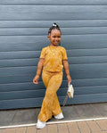 Girls' 2-piece clothes set with short sleeve top and flared pants by Showlu Fashion, featuring colorful prints for children aged 3 to 8.