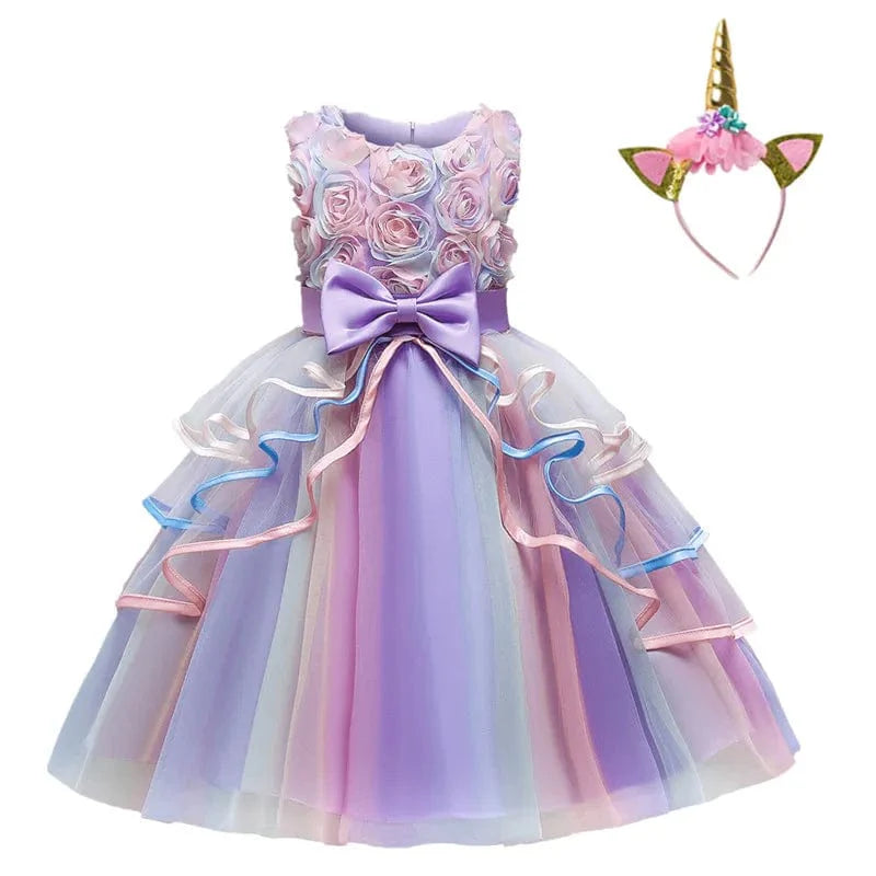 Pink unicorn rainbow layered ball gown for girls, featuring floral accents and bows, perfect for birthday parties and special occasions.
