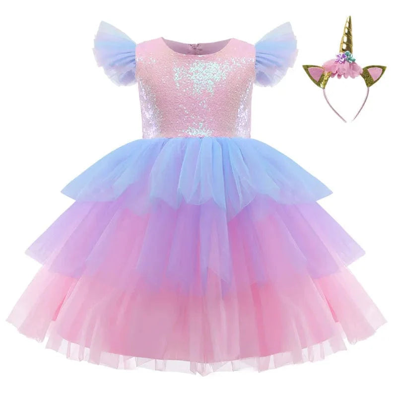 Pink unicorn rainbow layered ball gown for girls, featuring floral and bow details, perfect for parties or special occasions.