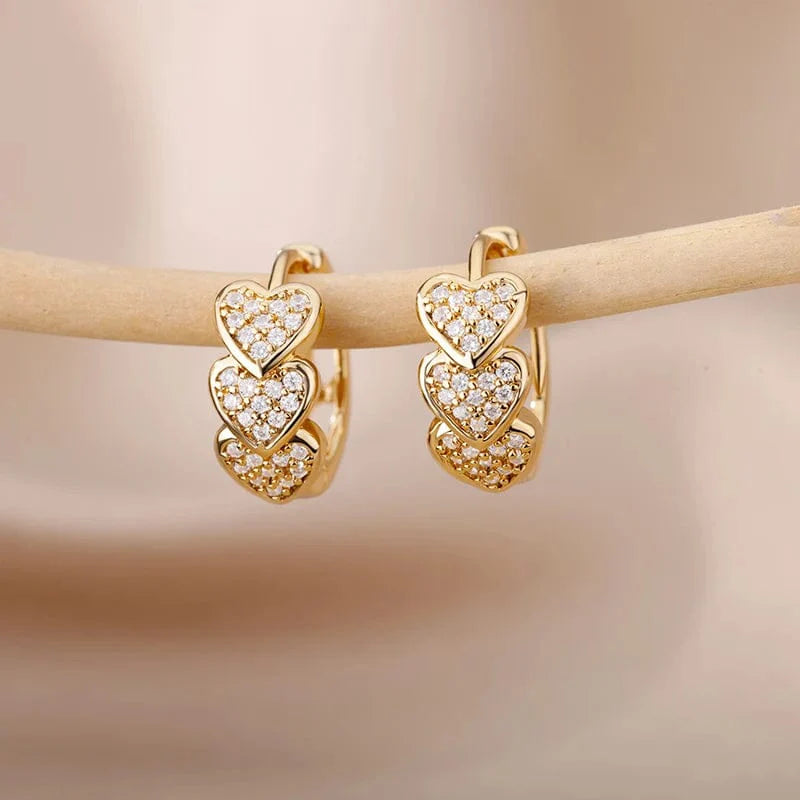 Gold stainless steel heart-shaped zircon stud earrings and delicate hoops for women, perfect for wedding or party jewelry.