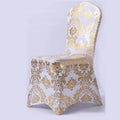 Gold metallic printed spandex chair cover for wedding and event décor, with elegant pattern design for party and dining room use