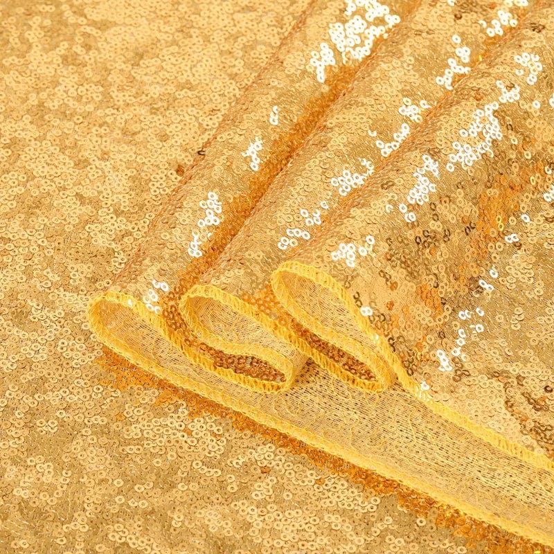 Gold sequin rectangle tablecloth for weddings, 108x50 inches, decorative table cover for special events and celebrations.