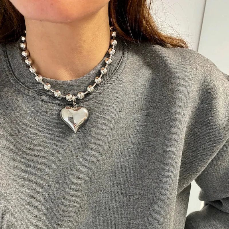 Gothic gold heart pendant necklace for women with stainless steel beaded choker, steampunk jewelry style.