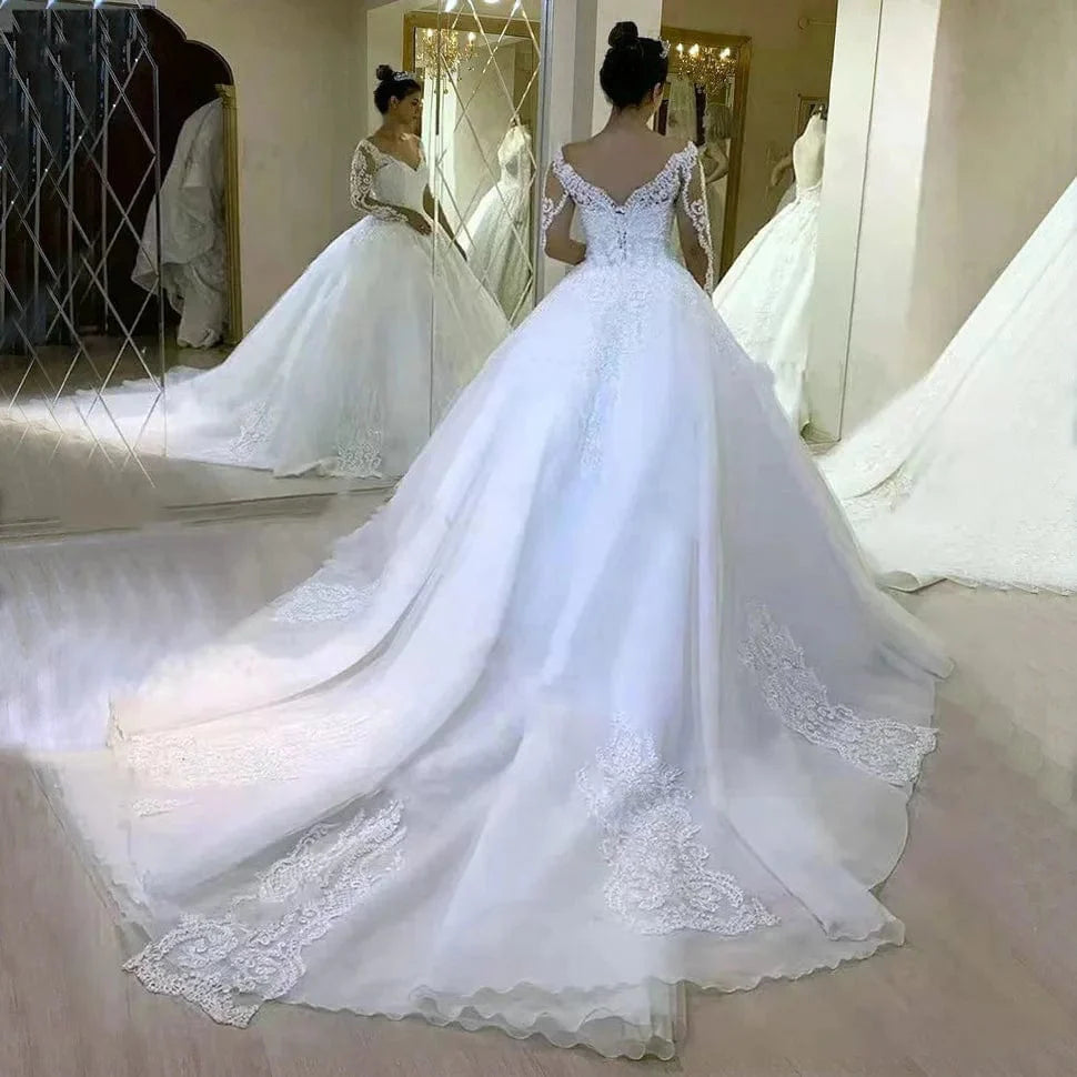 Graceful QQ Lover V-Neck Tulle Ball Gown wedding dress with full lace sleeves and appliques, showcasing elegance and custom craftsmanship.