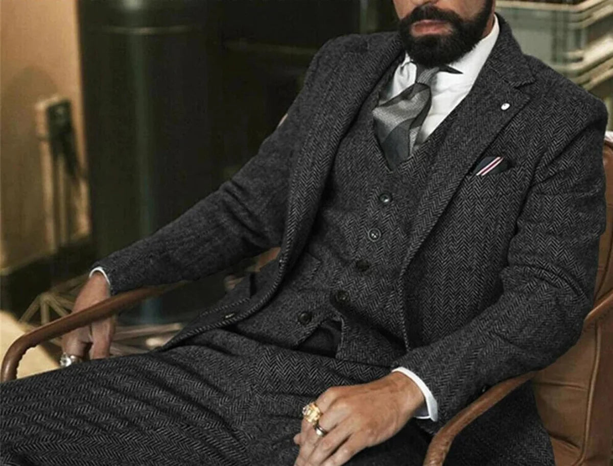 Gray herringbone wool tweed 3-piece winter suit for men, slim fit with jacket, vest, and pants, ideal for formal occasions or weddings.