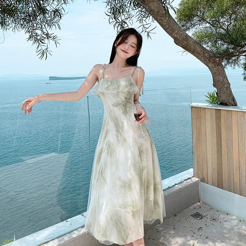 Green chiffon fairy holiday dress by Showlu Fashion, off-shoulder style with flowing, lightweight fabric for festive occasions.