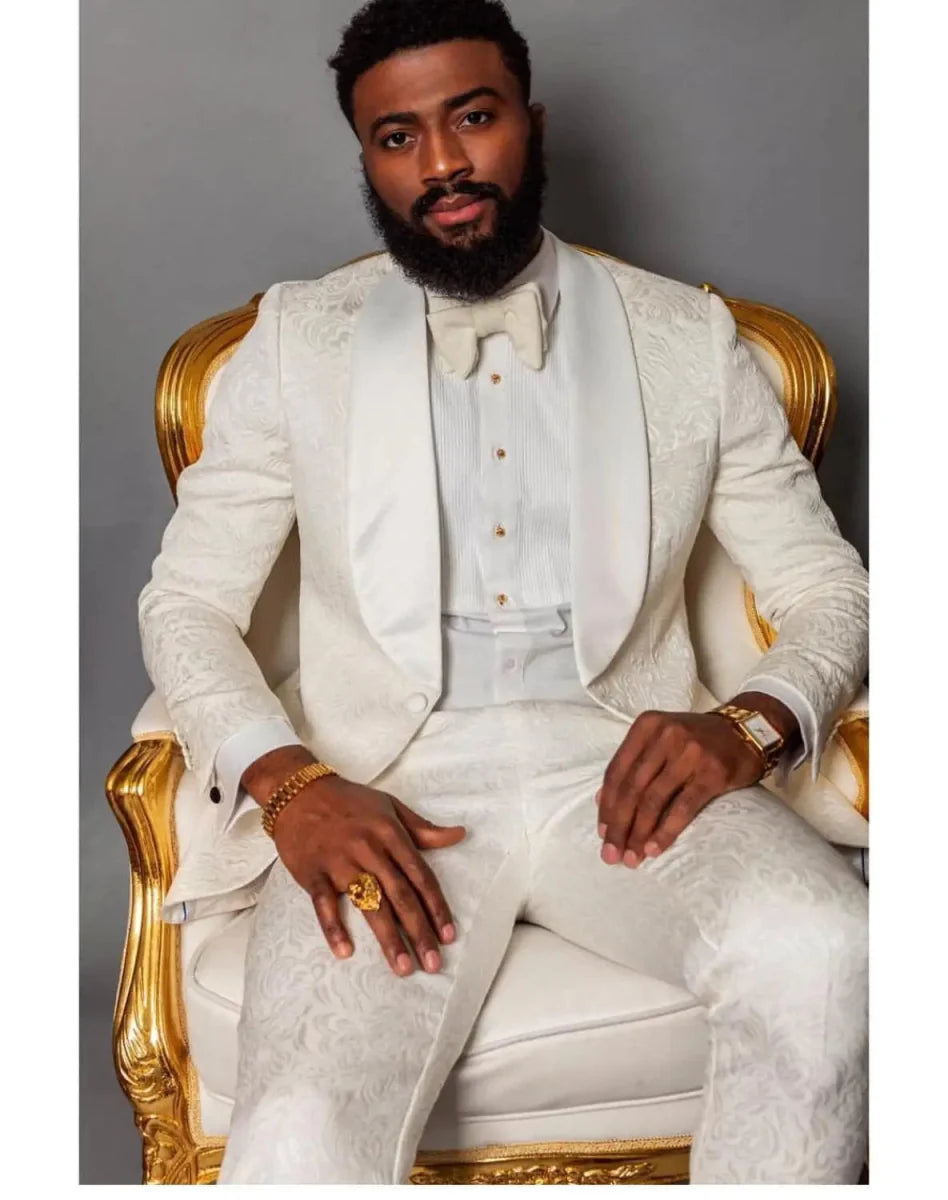 Ivory patterned men's tuxedo with shawl lapel, jacket and pants, perfect for wedding grooms and formal occasions.
