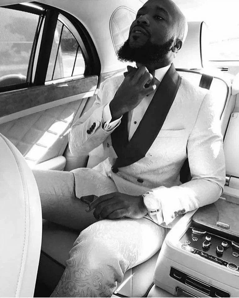 Ivory patterned men's tuxedo with shawl lapel, jacket and pants, perfect for weddings and formal occasions.