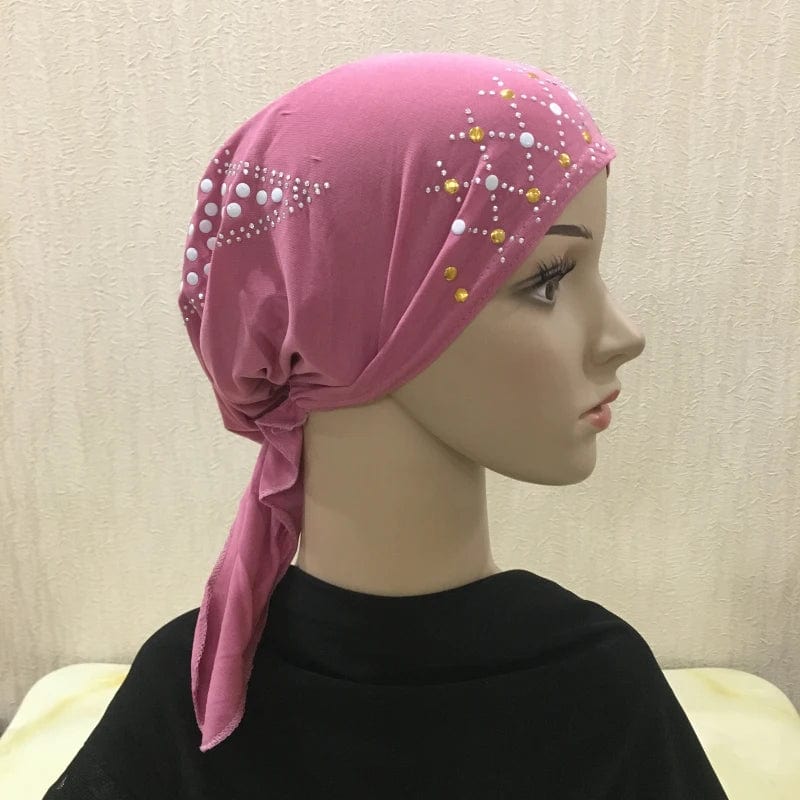 Showlu Fashion gold sequin linen hijab turban headwrap for Muslim women, stylish Islamic scarf with pull-on design and decorative sequins.
