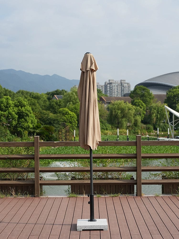 Showlu Fashion Creek Yueshui Shore Half Outdoor Parasol mounted on wall, providing shade on balcony or garden with green plants.