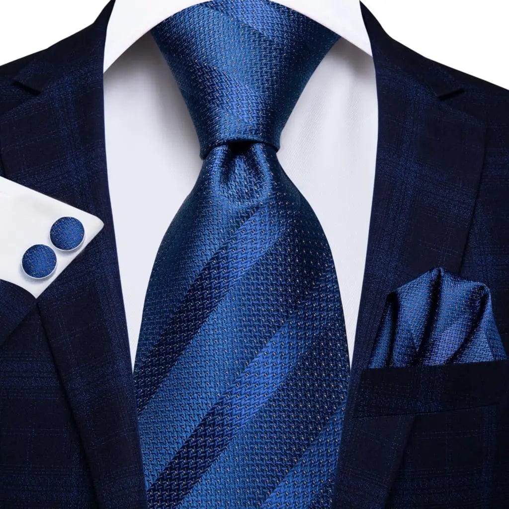 Navy blue striped silk tie set for men includes necktie, matching hanky, and cufflinks, perfect for formal and business occasions.