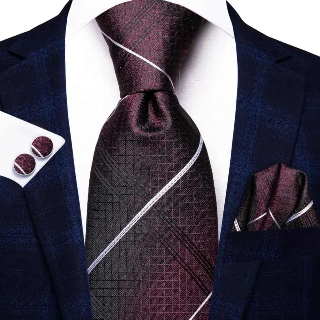 Navy blue striped silk men's tie set with matching hanky and cufflinks, perfect for formal occasions and business events.