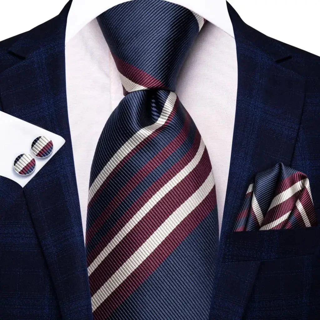 Navy blue striped silk tie set with matching hanky and cufflinks for men, featuring a stylish design for formal and wedding occasions.