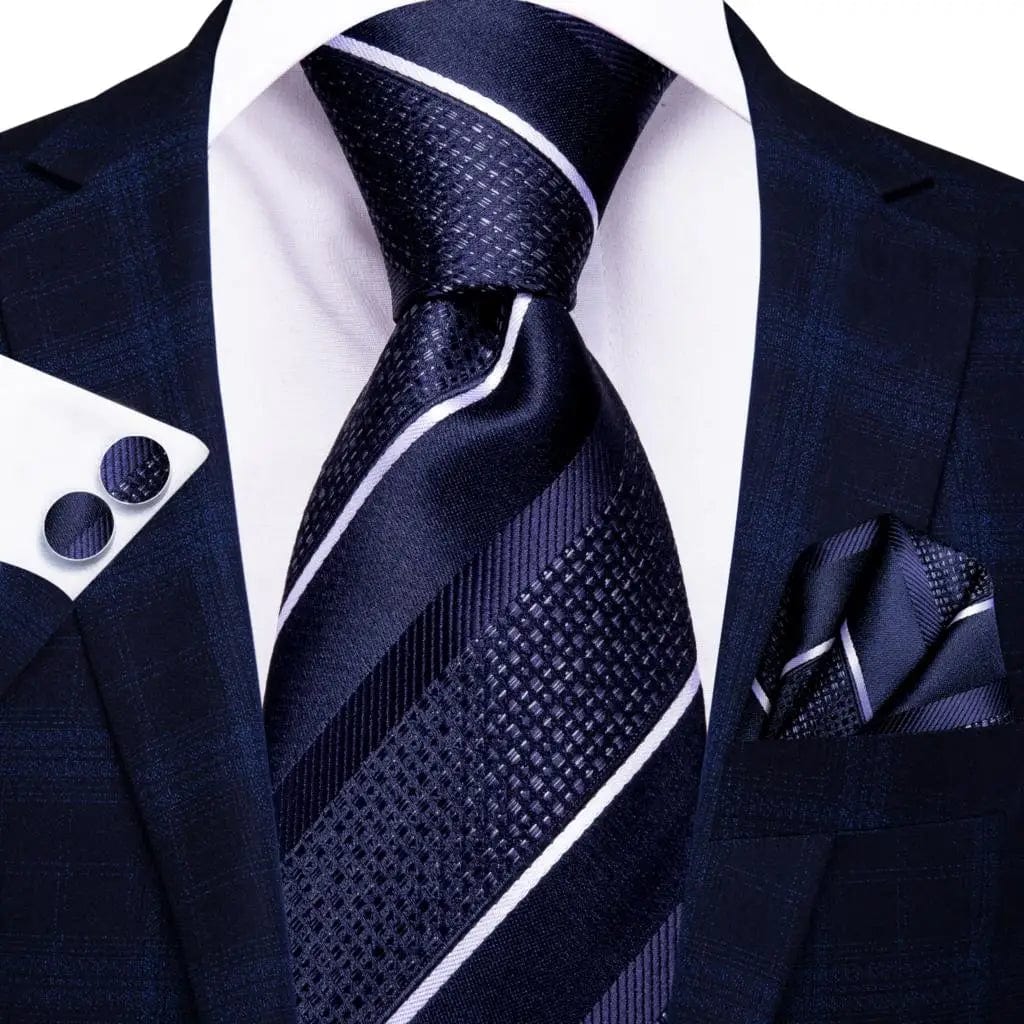 Navy blue striped silk tie set for men includes necktie, matching hanky, and cufflinks, perfect for formal and business occasions.