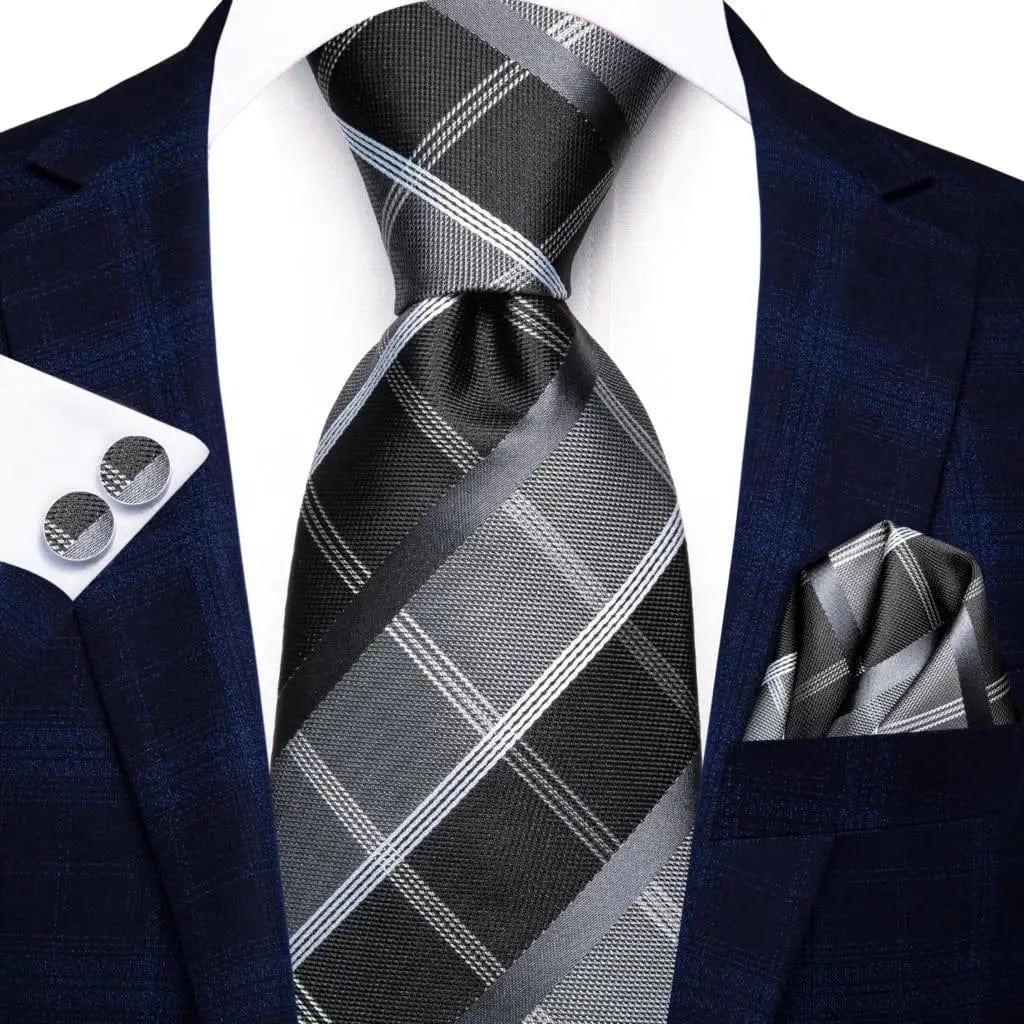 Navy blue striped silk tie set for men, includes necktie, pocket hanky, and cufflinks, perfect for formal or business occasions.