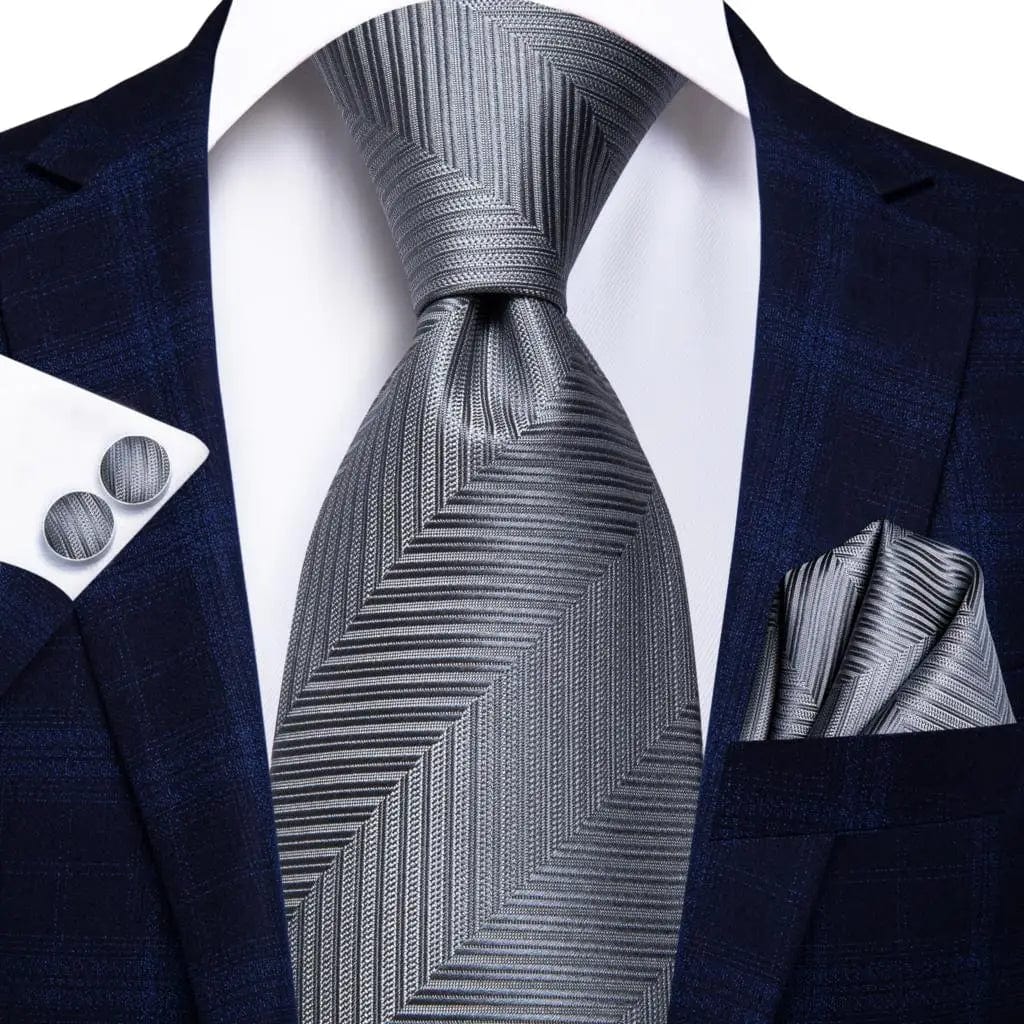 Navy blue striped silk tie set for men including necktie, pocket hanky, and cufflinks, perfect for formal and business occasions.