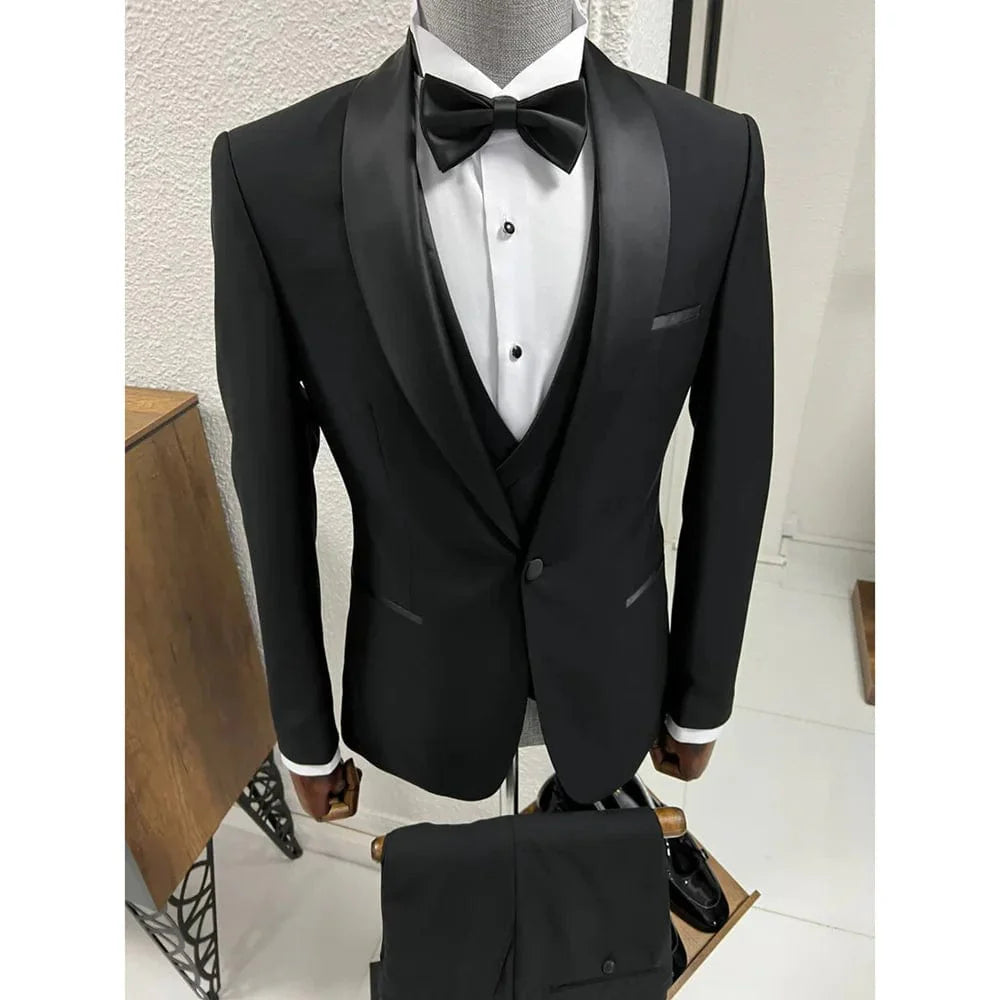 Black men's 3-piece slim fit tuxedo with shawl lapel, single-button jacket, vest, and pants for wedding or formal events.