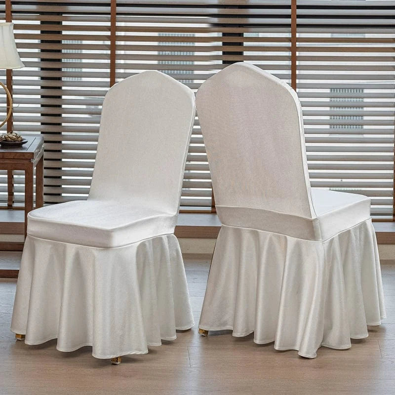 High-end satin bow chair cover for hotel, wedding, and banquet events featuring elegant design and luxurious fabric.