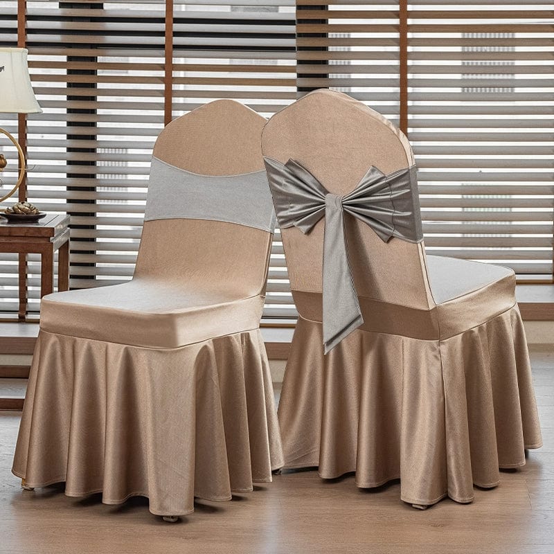 High-end satin bow chair cover for hotel, wedding, and banquet events, featuring elegant design and luxurious fabric.