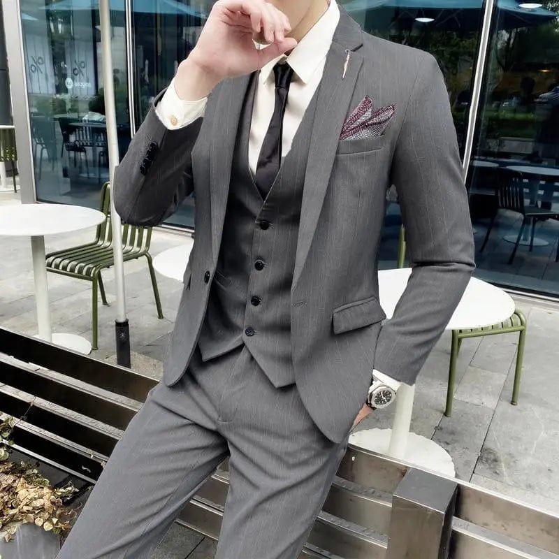 SHOWLU Men's British Slim Fit Three-Piece Suit with jacket, vest, and trousers, featuring a modern, stylish design for formal occasions.
