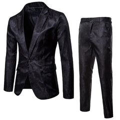 A black two-piece men's suit featuring a single-breasted blazer and matching trousers in jacquard.