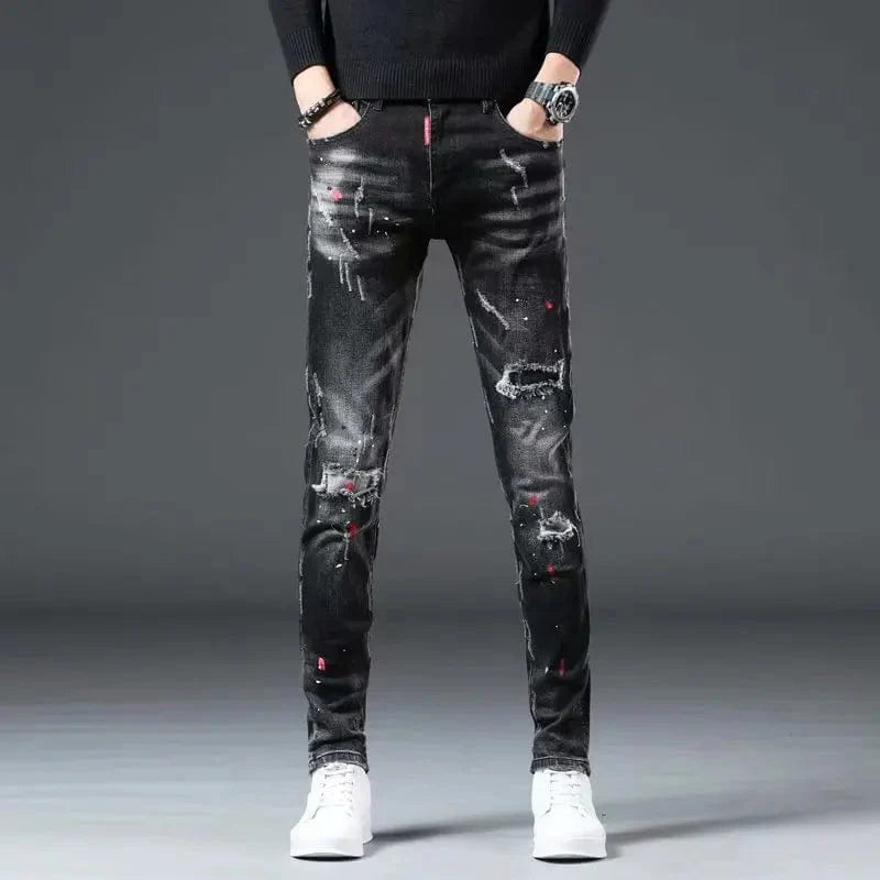 Black Showlu men's ripped skinny jeans with paint splash design, casual high-street denim pencil pants for teens and adults.
