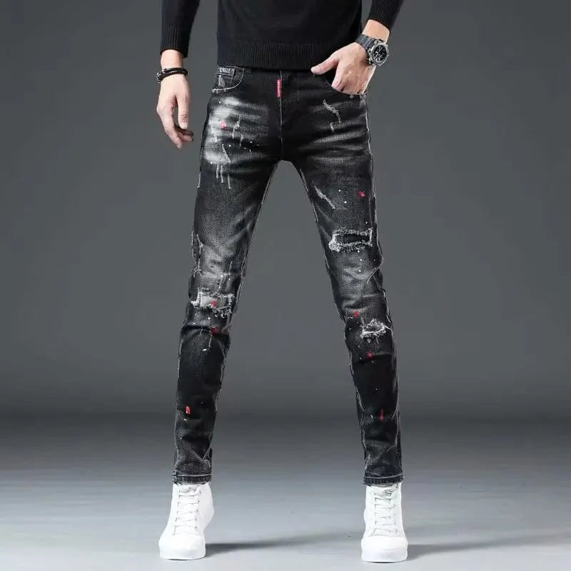 Black Showlu men's ripped skinny jeans with paint splash design, patch details, high-street fashion style, casual denim pencil pants