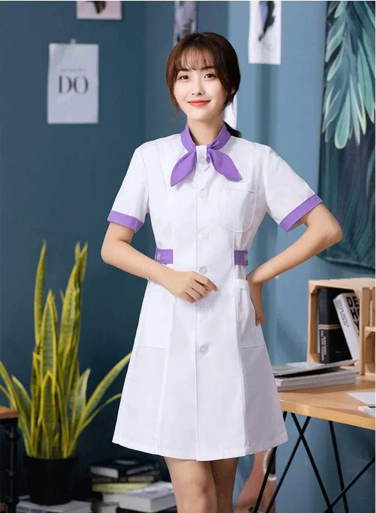 White Showlu Female Nursing Scrubs Dress with bow tie, hospital uniform blouse, and professional medical attire for women.