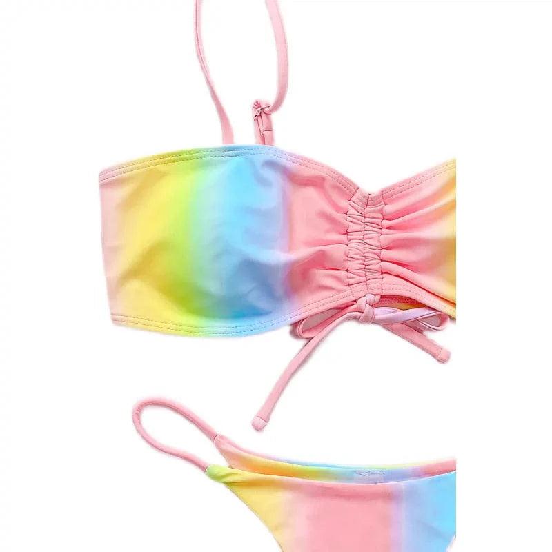 Women's tie-dye T-back bikini swimsuit by Showlu Fashion, featuring a vibrant split design and stylish T-back detail.